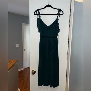 Lulu’s “Never a Dull Moment Emerald Green Tie-Strap Pleated Midi Dress”